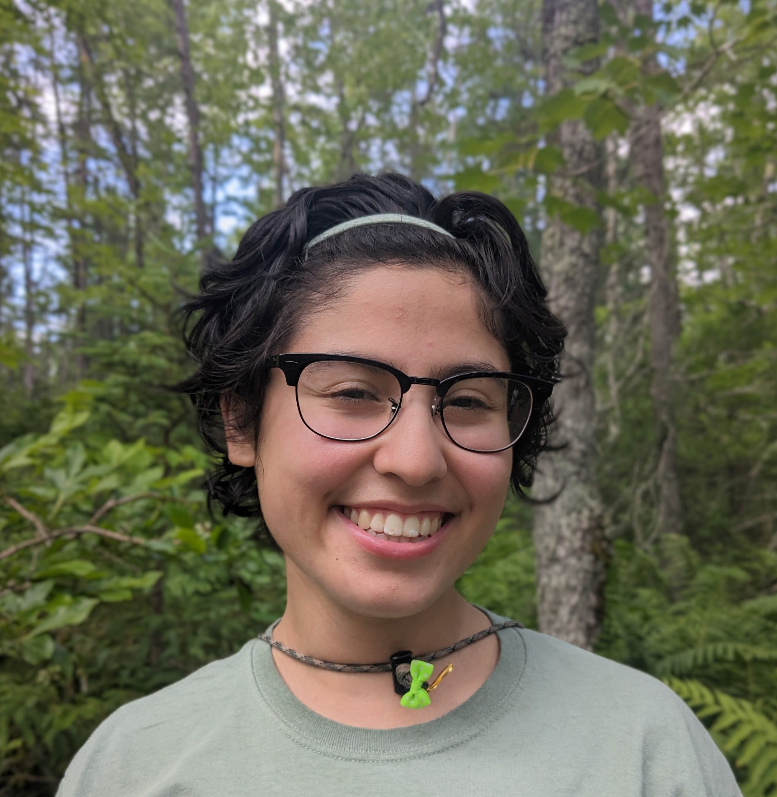 Liz Amador posing in front of trees