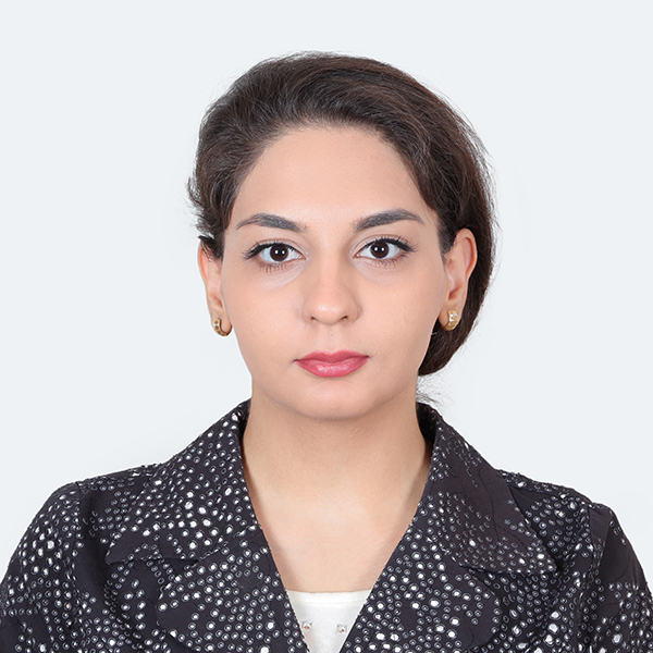 Zahra Najjar Khodabakhsh posing in front of a white background