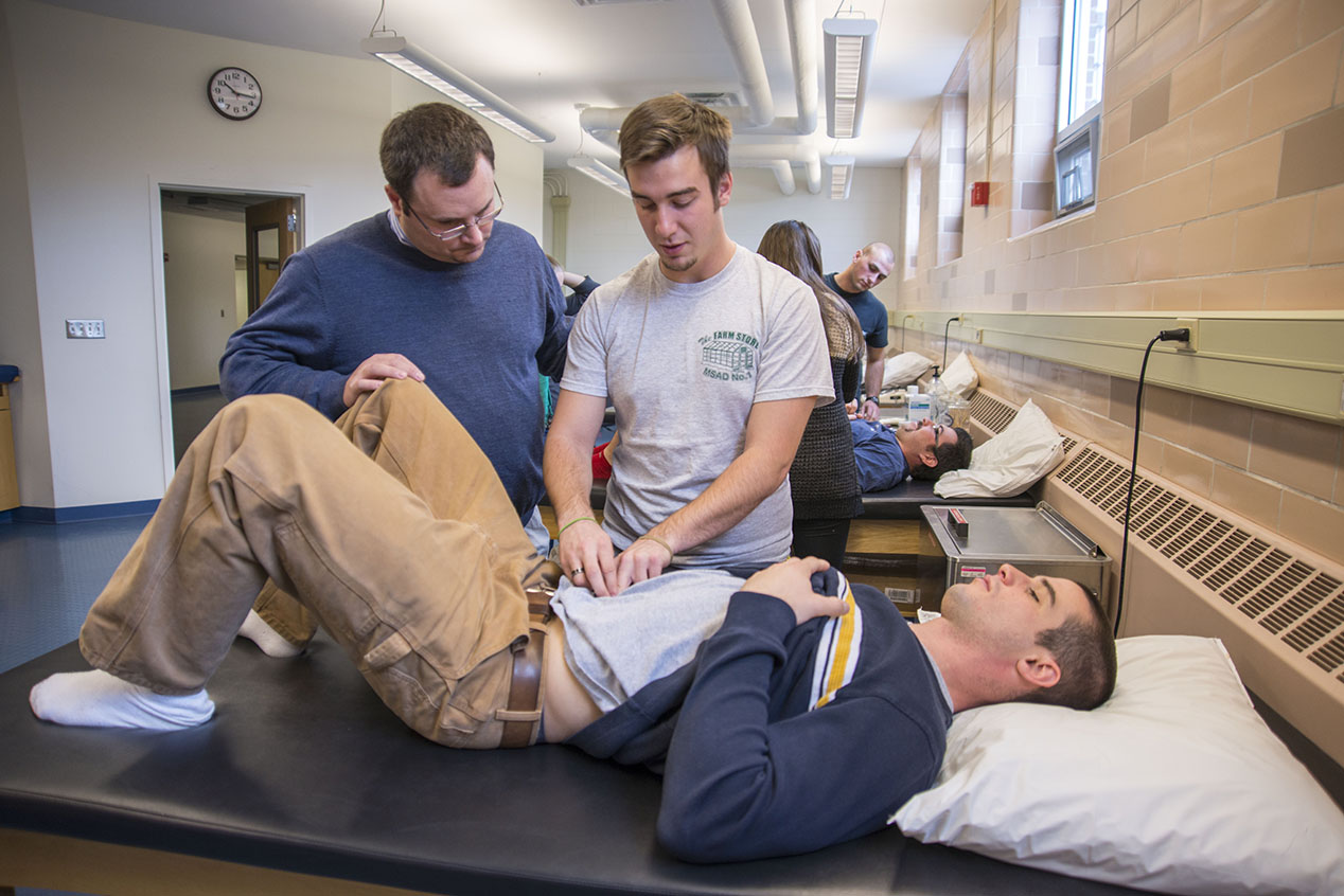 A photo of an athletic training lab class at the University of Maine.
