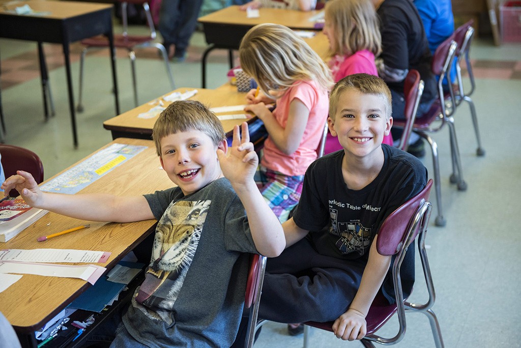 A photo of smiling elementary students.