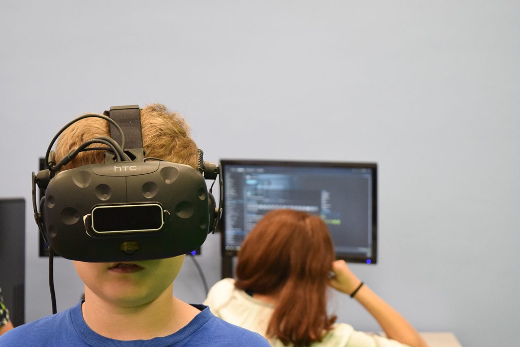 A photo of a student wearing a virtual reality headset.