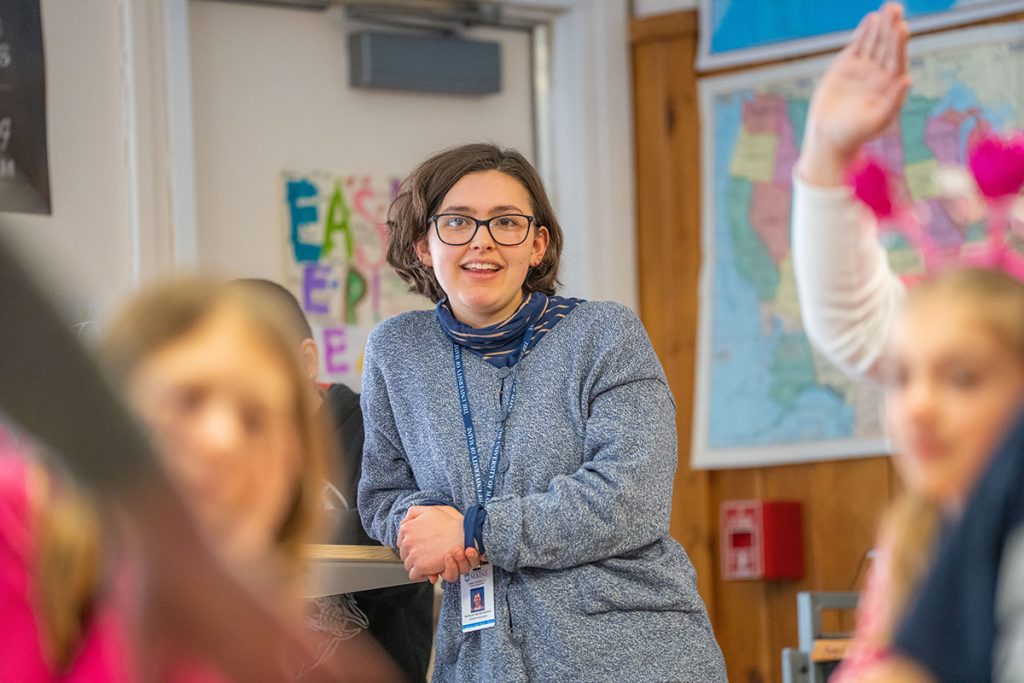 Natalie McCarthy, a senior elementary education major at the University of Maine College of Education and Human Development, teaches a lesson about therapy dogs to a fourth-grade class at Asa Adams Elementary School where McCarthy is doing her student teaching.