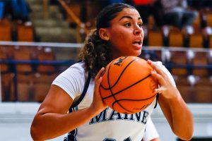 A photo of Adrianna Smith on the basketball court.