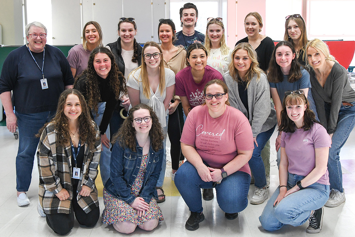 University of Maine students from associate professor of literacy Susan Bennett-Armistead's ERL 319 class at the Literacy Night held at Viola Rand Elementary School in Bradley, Maine.