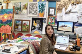 A picture of Yagmur Gunel in her office surrounded by works of art.