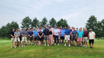 University of Maine alumni and students pose for a photo at the 2023 Aces for Inclusion benefit golf tournament at Fairlawn Golf and Country Club in Poland, Maine.