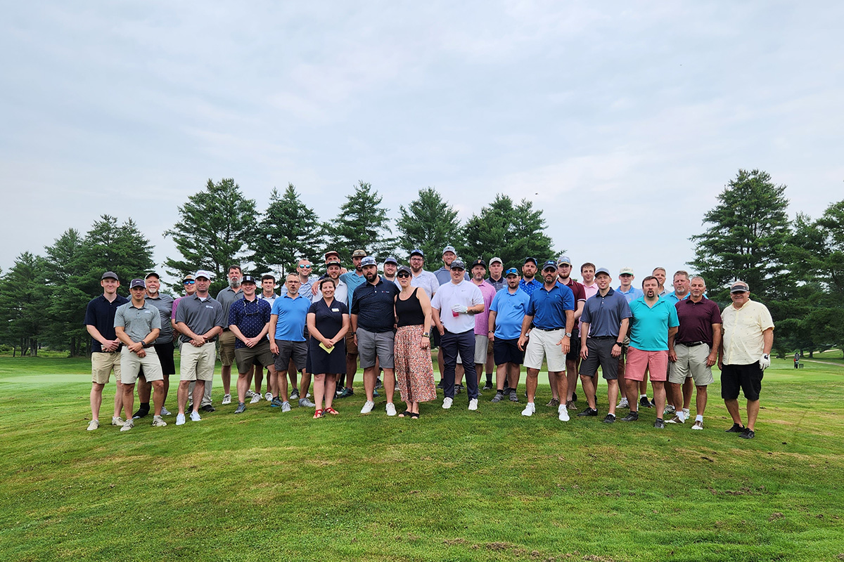 University of Maine alumni and students pose for a photo at the 2023 Aces for Inclusion benefit golf tournament at Fairlawn Golf and Country Club in Poland, Maine.