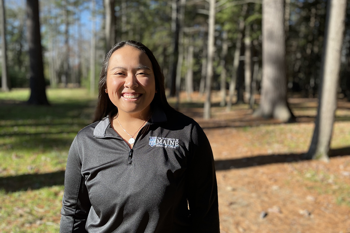 A photo of Kimmy Chhoeuk on the University Trails on the University of Maine campus.