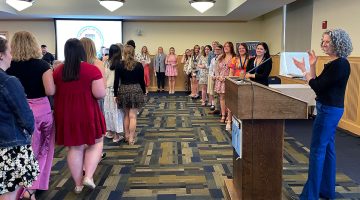 College of Education and Human Development students who earned academic excellence honors throughout their undergraduate careers line up to receive their awards at the college's 2024 Student Recognition Ceremony.