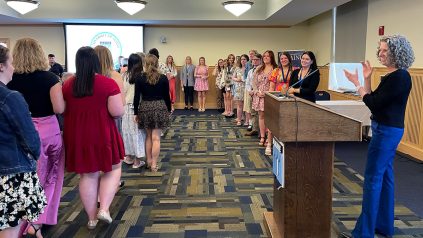College of Education and Human Development students who earned academic excellence honors throughout their undergraduate careers line up to receive their awards at the college's 2024 Student Recognition Ceremony.