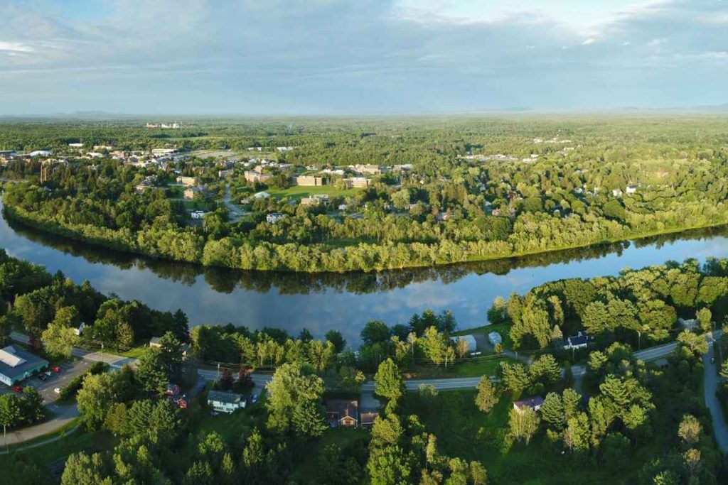 An aerial photograph of the University of Maine campus and the Stillwater River.