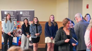 Teacher candidates line up to receive their pins at the University of Maine College of Education and Human Development's second annual Pinning and Recognition Ceremony, January 24, 2025.