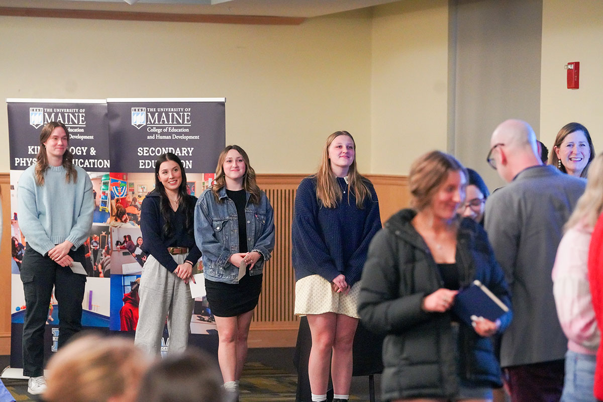 Teacher candidates line up to receive their pins at the University of Maine College of Education and Human Development's second annual Pinning and Recognition Ceremony, January 24, 2025.