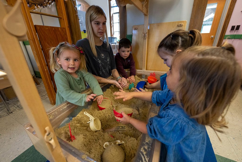 University of Maine students work with preschoolers at the Katherine Miles Durst Child Development Learning Center.