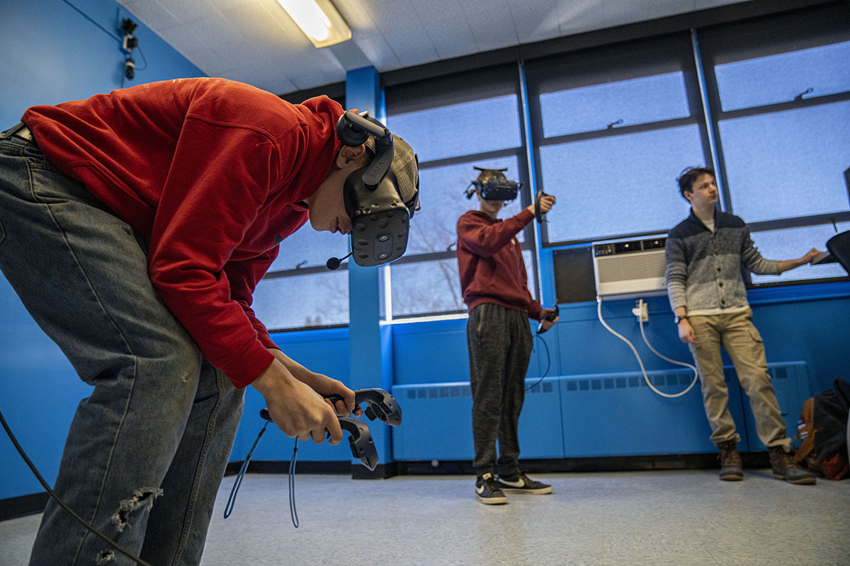 Students from Telstar High School get a demonstration of the Immersive Mathematics in Rendered Environments Lab at the University of Maine.