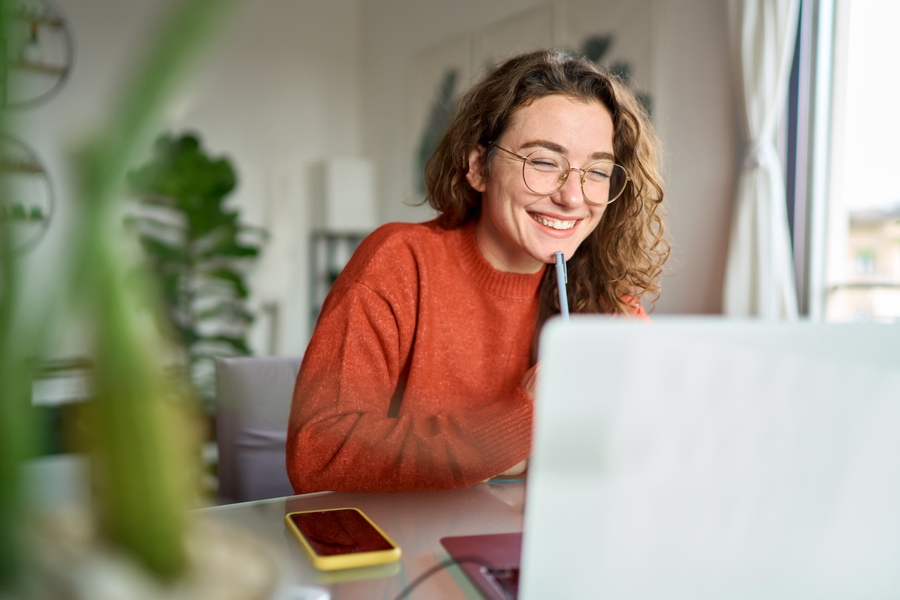 Person smiling during a virtual event.