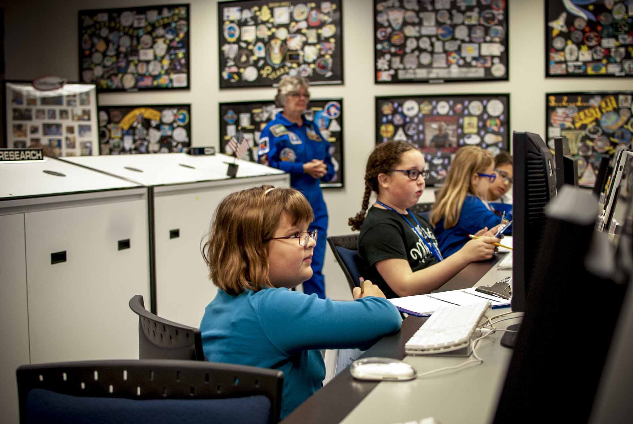 Girls at the Challenger Learning Center working on computers