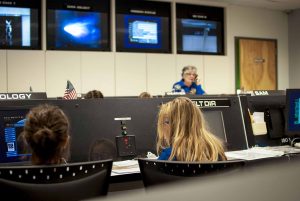 Girls working on computers during a challenger learning center mission