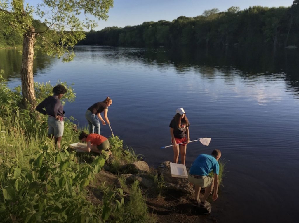 Image of students testing river water