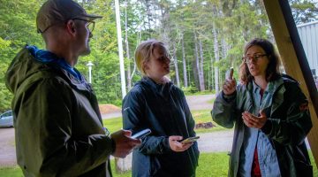 Sharon stands to the right as she discusses index site sampling with two Maine-eDNA researchers.