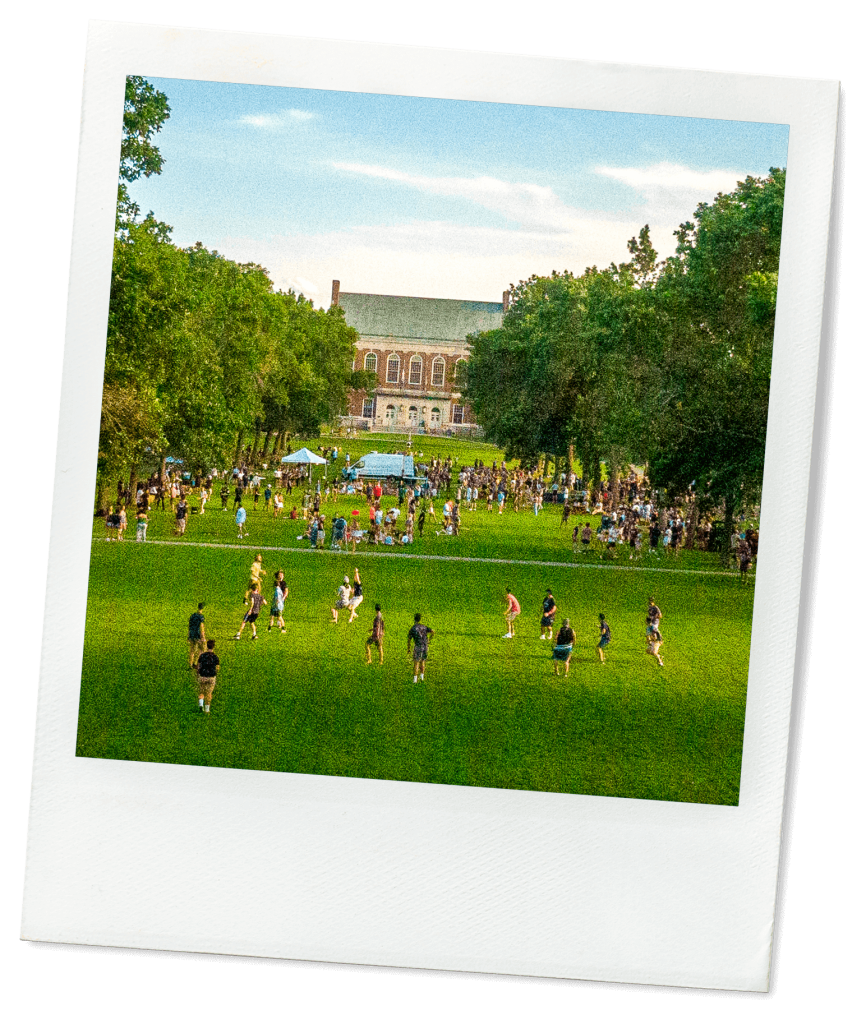 A photo of many people on UMaine's grassy Mall