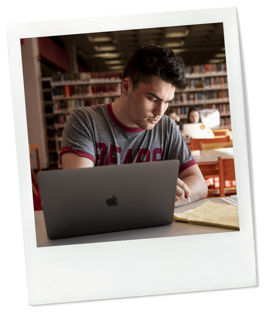 A photo of a student studying in Fogler Library