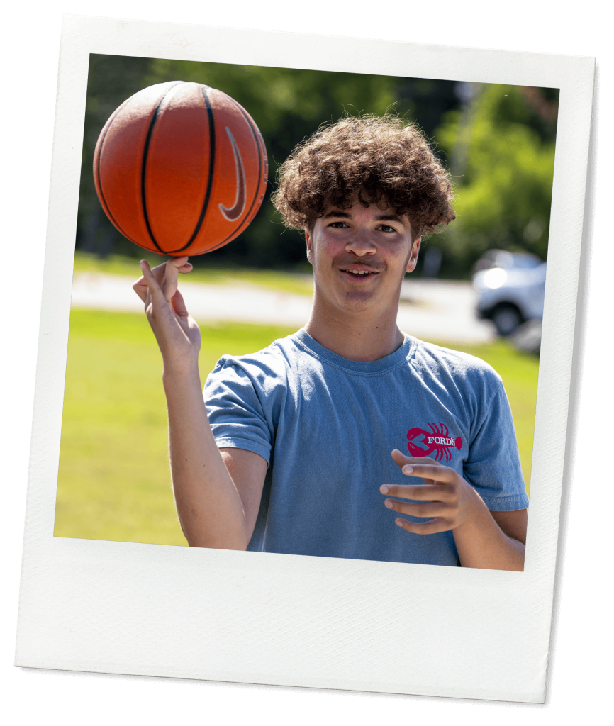 A photo of a person holding a basketball