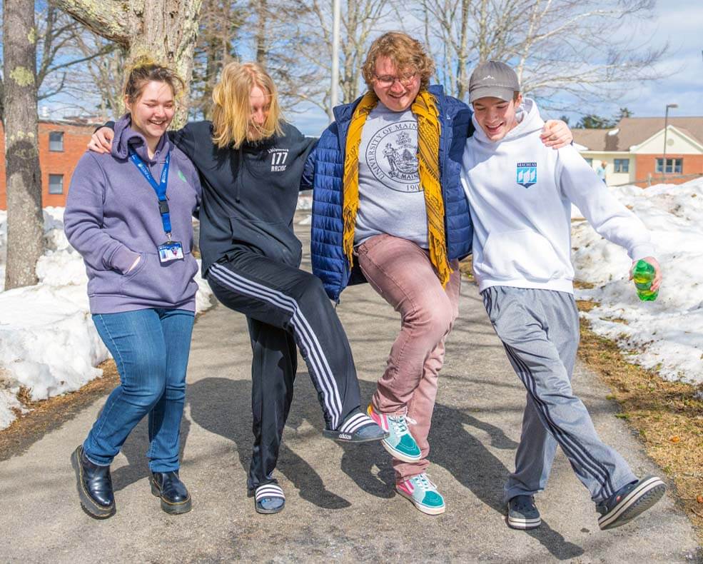 A photo of four people in winter