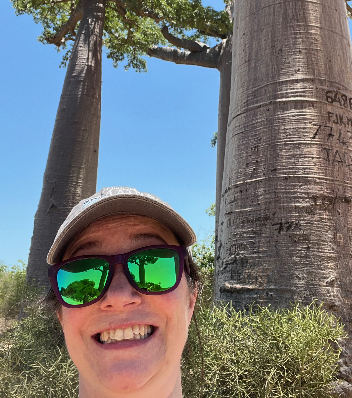 Image of Danielle Levesque smiling with trees in the background.