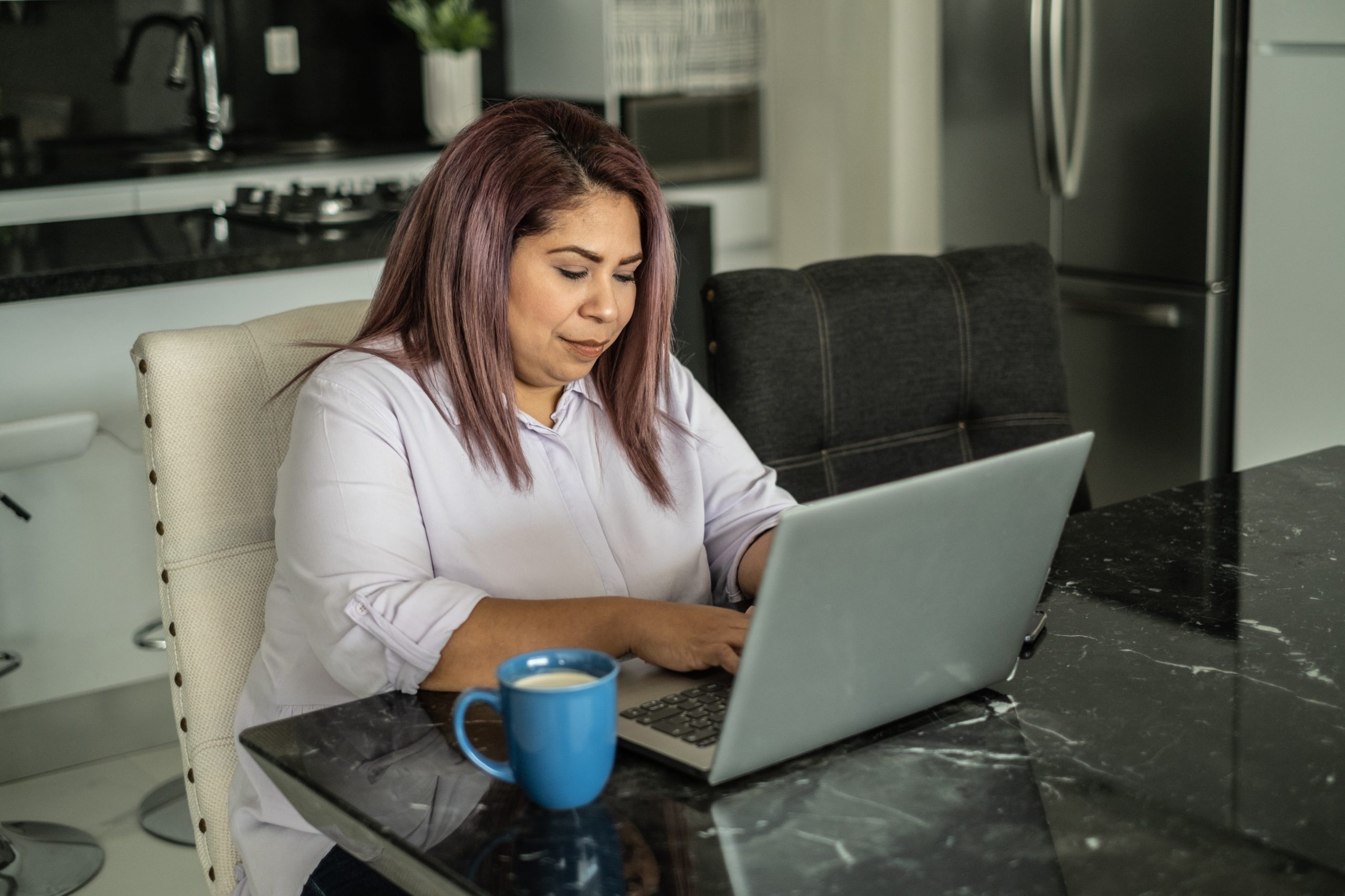 Adult student working on a laptop