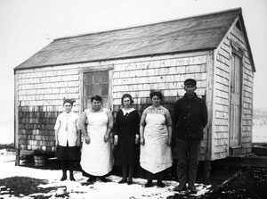 The women in this picture worked in the lumber camps and lived in Lincoln County, Maine. It seems that they were in the middle of some chore when interrupted for this picture. What were they doing? [P1987]