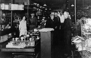 The girl behind the counter in the white dress was working at another 'female' occupation, that of store clerk. Her job was unusual, however, because in this photo she is working at Russell's Hardware Store in Rangeley, Maine, in 1924. [P 6529]