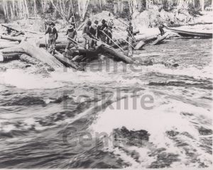 P299_Men-clearing-small-log-jam-with-peaveys_Wassataquoik-River