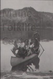 P06025 William Sleepy Atkins in canoe with moose c.1904.