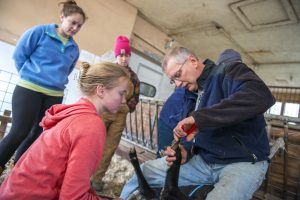 Photo of Jim Weber with students at Witter Center.