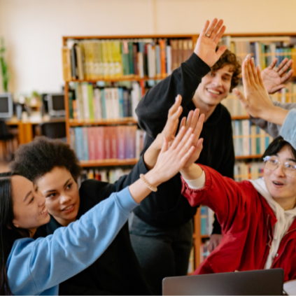 image of several high school students laughing and high fiving