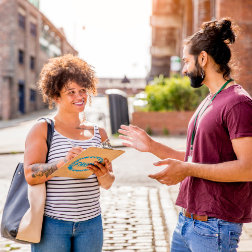 picture of two people talking in the street