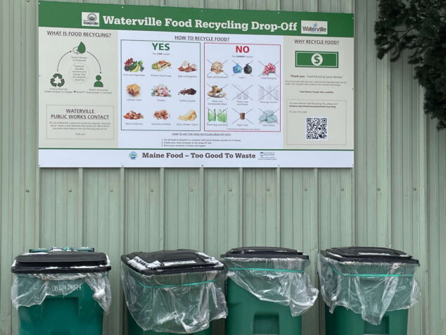 Image of waterville food recycling drop off sign hanging over bins