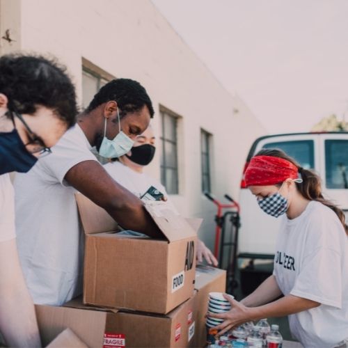 People packing things into boxes