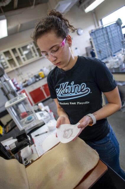 Student holding nanocellulose sample