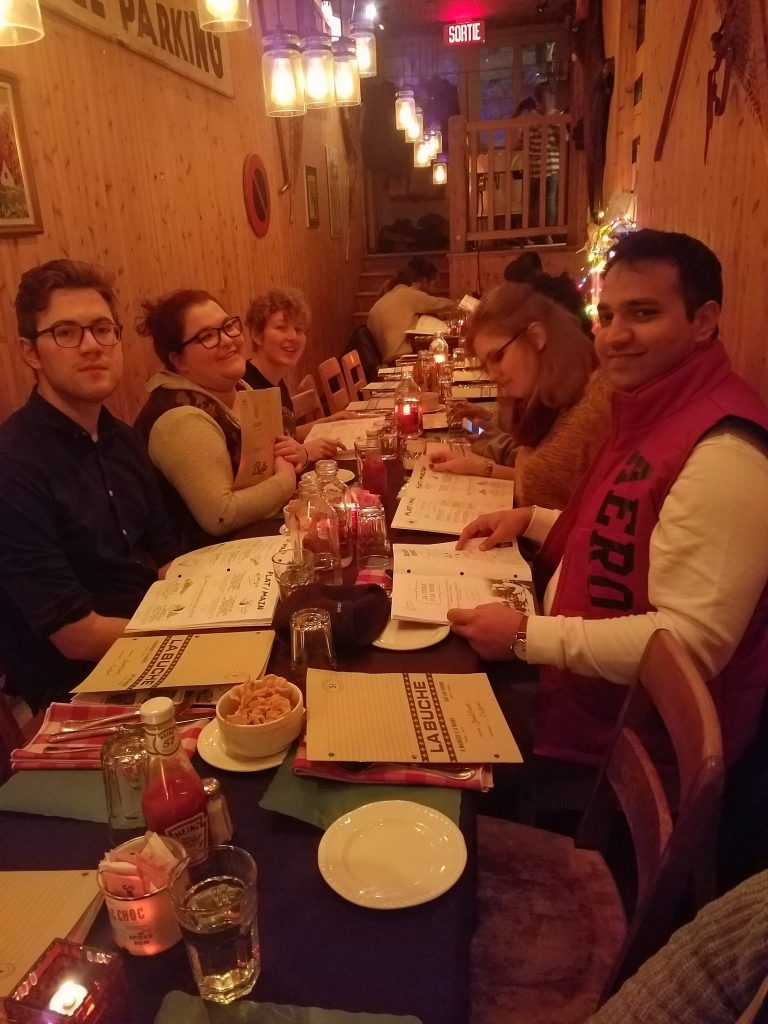A photo of a group at dinner