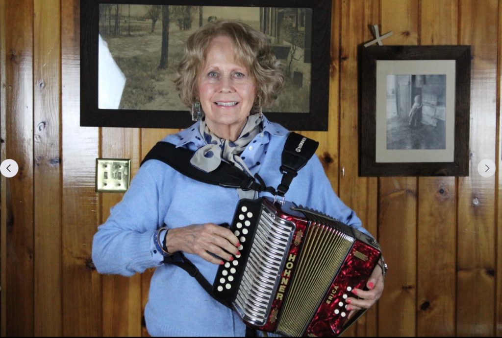 A photo of a woman with an accordion