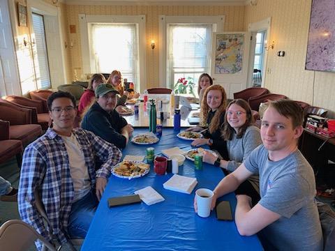 A photo of a a group around a table