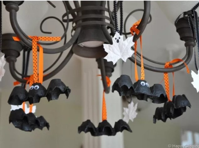 Egg Carton Bats hanging on a chandelier