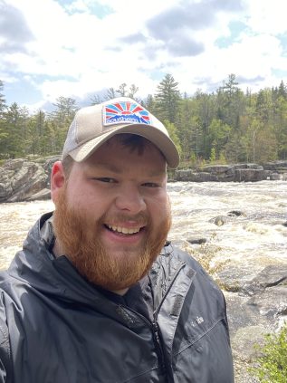 Eyan Fennelly posing on a bedrock outcrop