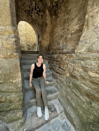 Meg sitting on steps