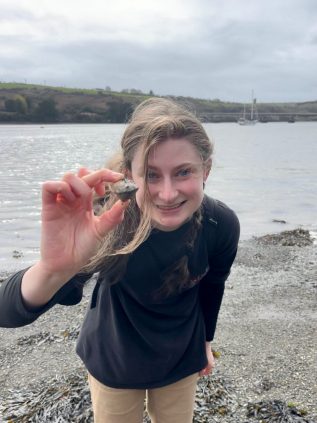 Angelina holding a rock