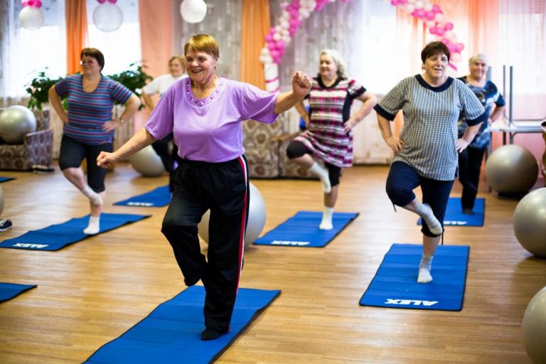 Group of elderly women exercising 