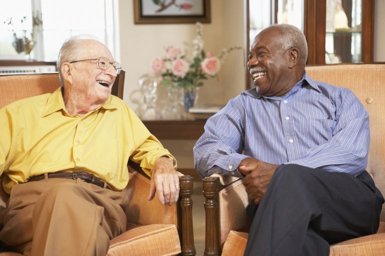 Elderly men sitting having a conversation