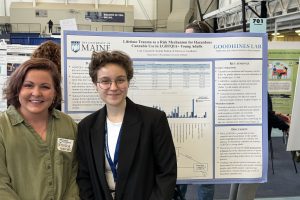 Dr. Patricia Goodhines and Leah Cingranelli in front of Leah's poster at the UMaine Symposium